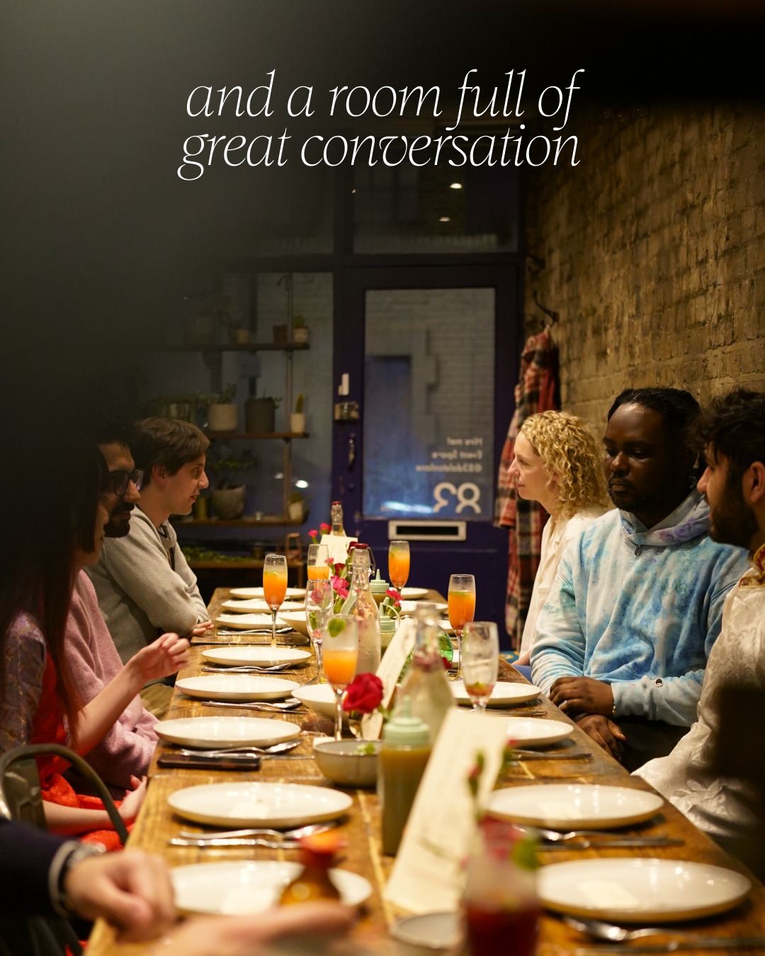 Guests sharing conversation around the supper club table