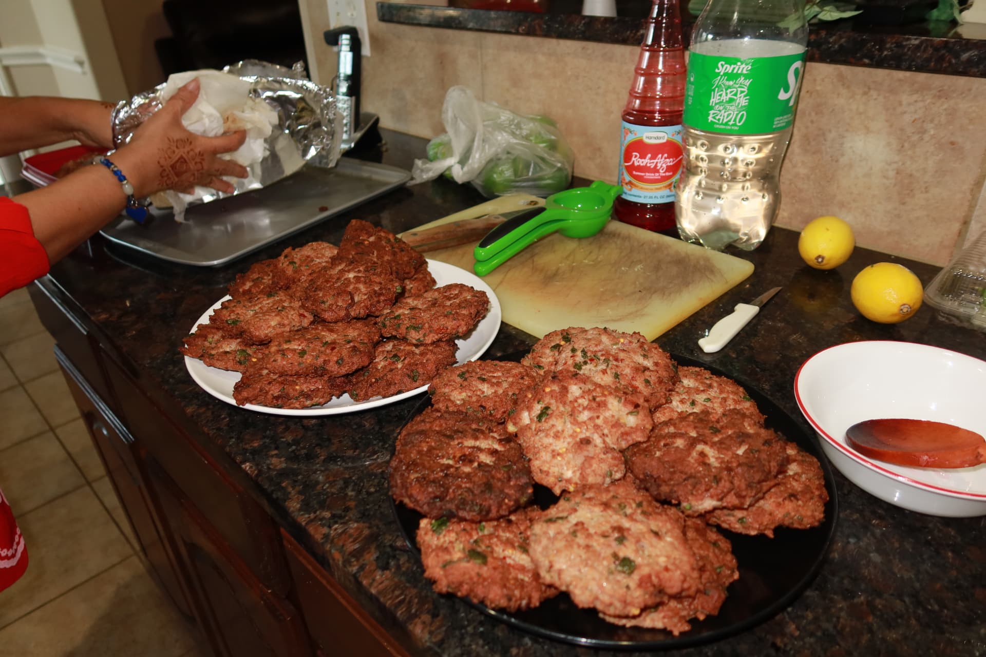 Freshly fried chapli kebabs plated in the kitchen